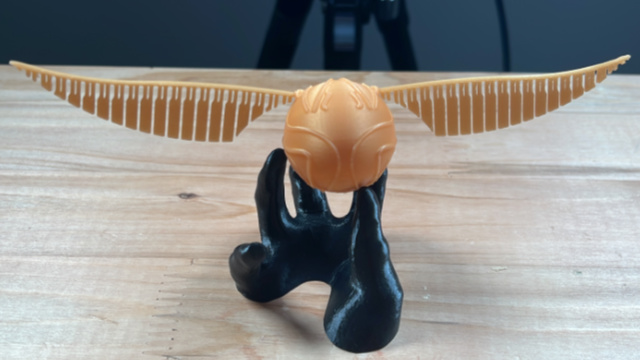Goldener Schnatz in Hand